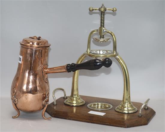 A brass lemon squeezer and a coffee pot, squeezer height 36cm
